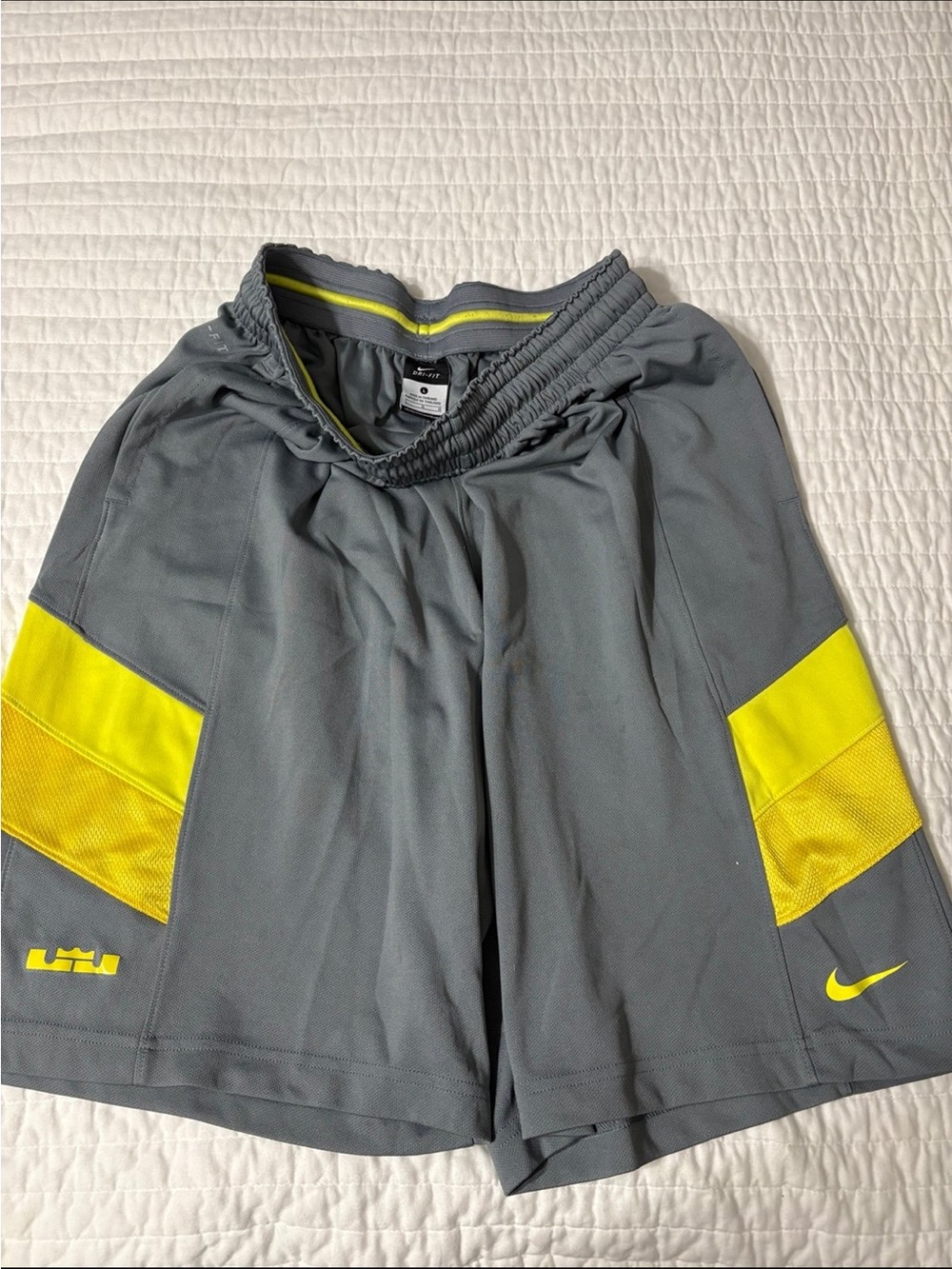 Nike Men’s Gray Athletic Shorts with Yellow Accents